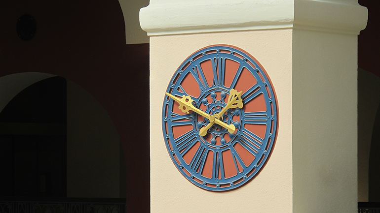 Close up of a wall clock in the main building